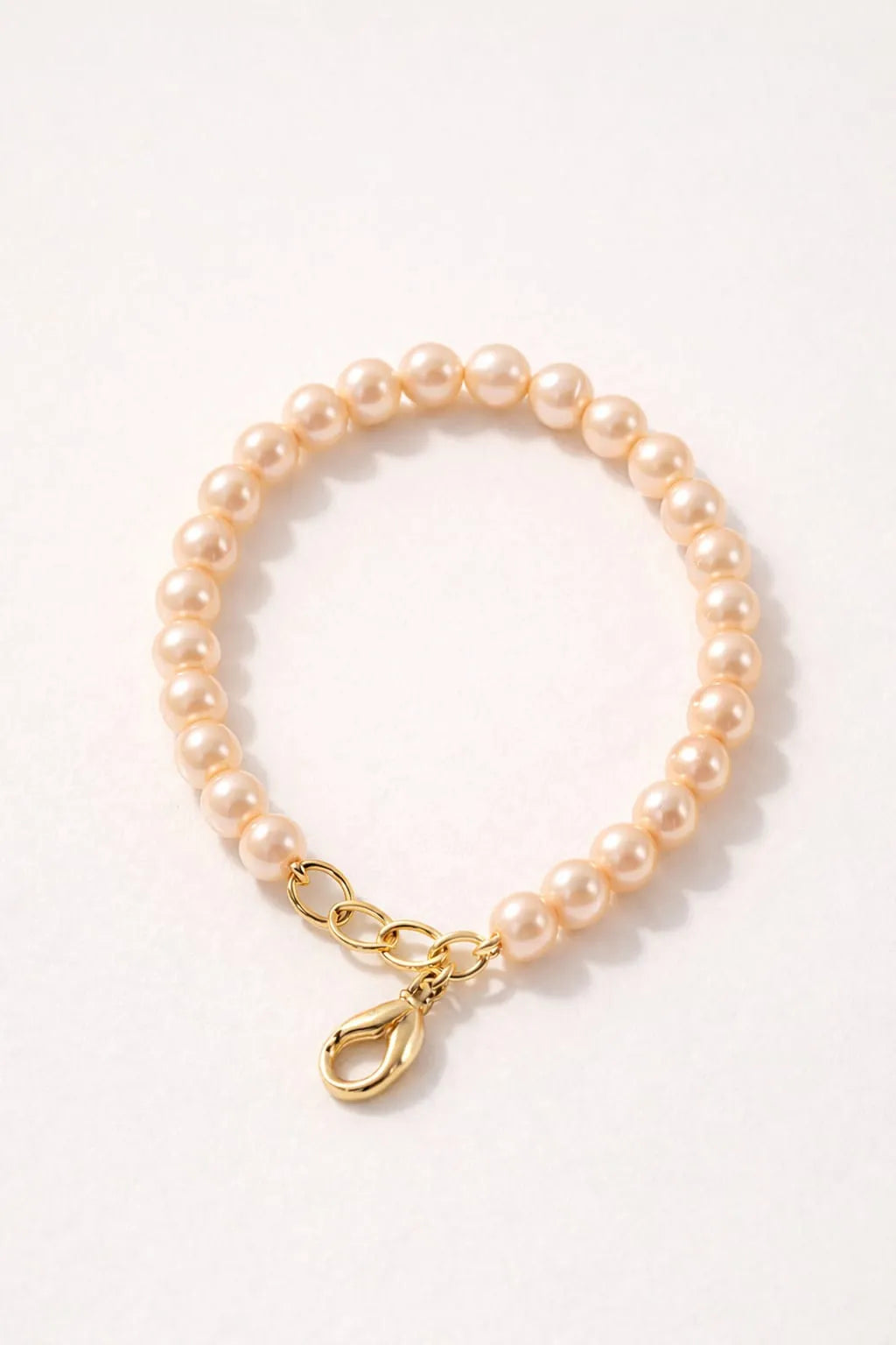 Pearl Bracelet Trio Set peach single strand bracelet image