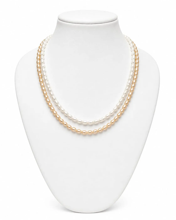 Classic layered pearl necklace set on jewellery display bust