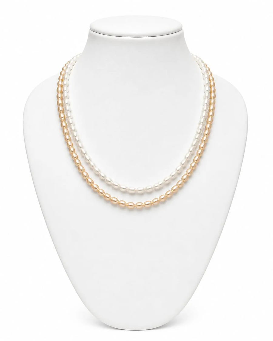Classic layered pearl necklace set on jewellery display bust