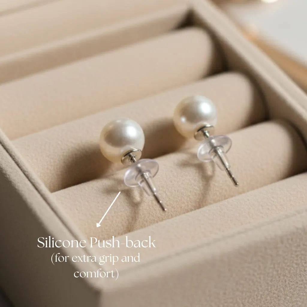 Freshwater pearl stud earrings silver post and silicone push-back closeup
