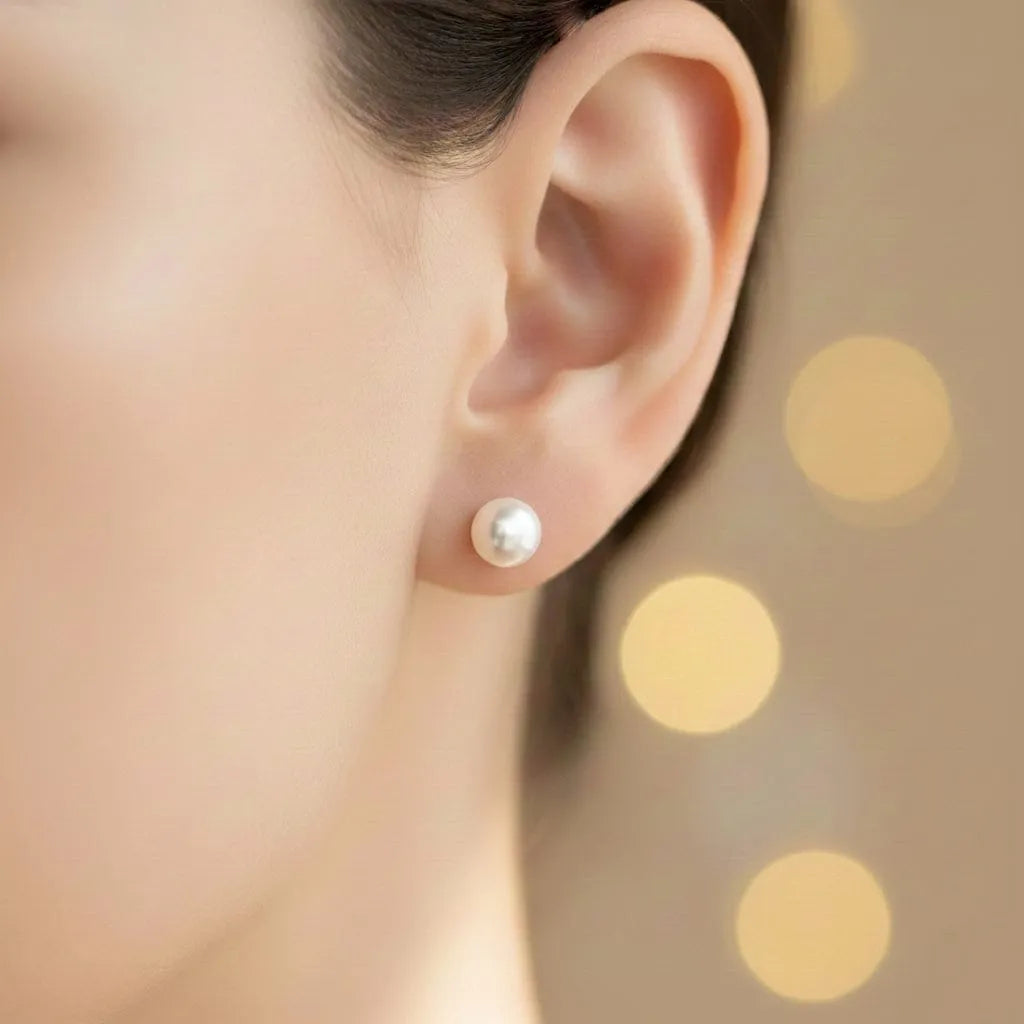 Freshwater pearl stud earrings white pearl on-ear lifestyle image